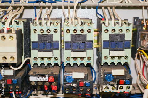 Several old relays with connected colored wires.