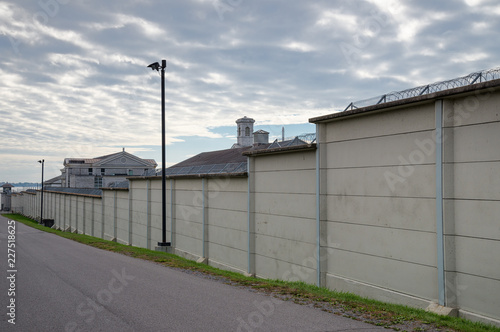 Prison wall with barbed wire