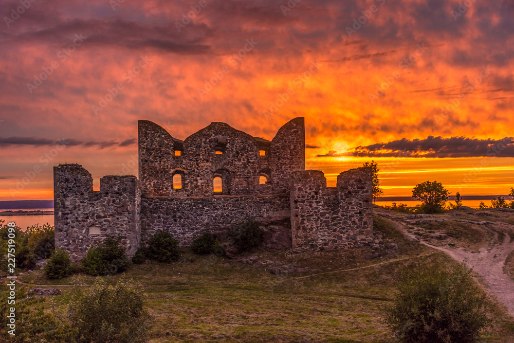 Beautiful sunset on the Brahehus ruined castle, near the Vattern Lake, Sweden Beautiful sunset on the Brahehus ruined castle, near the Vattern Lake, Sweden
