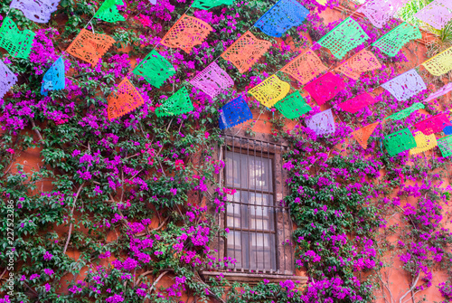 Colorful paper flags over street
