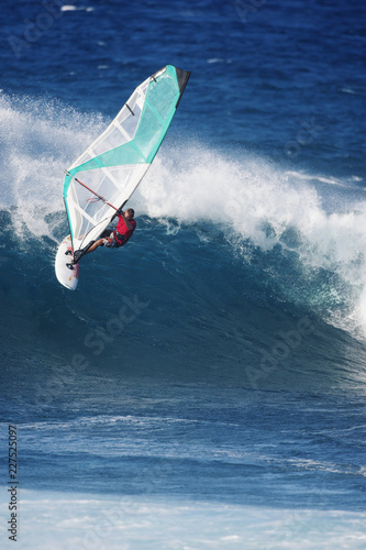 Fotografie Man windsurfing in sea
