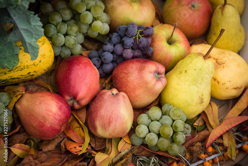 Heap of fresh, colorful autumn fruits - apple, pear, grape