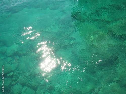 Beautiful clear underwater surface and rocks in sunny days