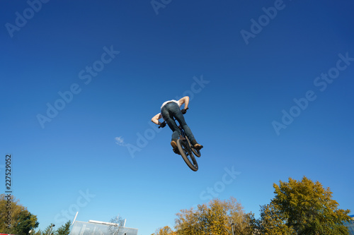Biker doing stunt in the sky