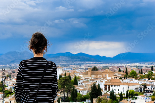 Ancient moorish tower from the point of view of landmark palace Alhambra facing the city of Granada, Spain