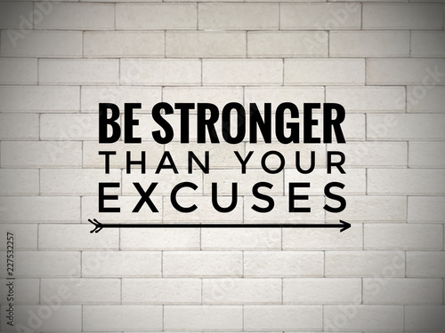 Motivational and inspirational quote - ‘Be stronger than your excuses’ written on white blurred wall background.