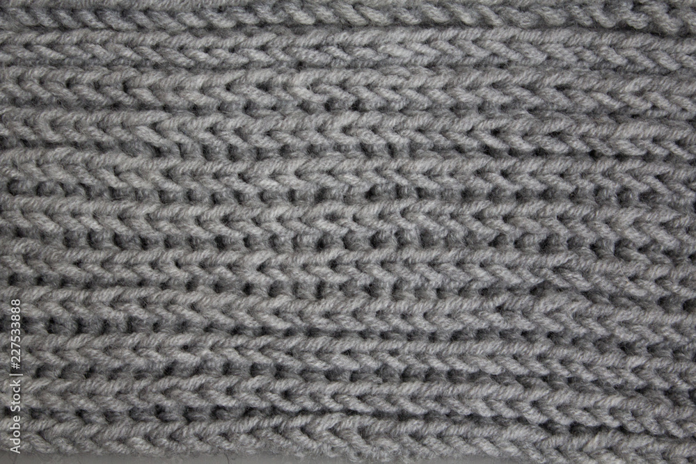 Texture of knitted woolen handmade for an abstract background Texture of knitted woolen handmade for an abstract background
