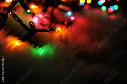 Christmas Lights in the Dark on Fluffy Background