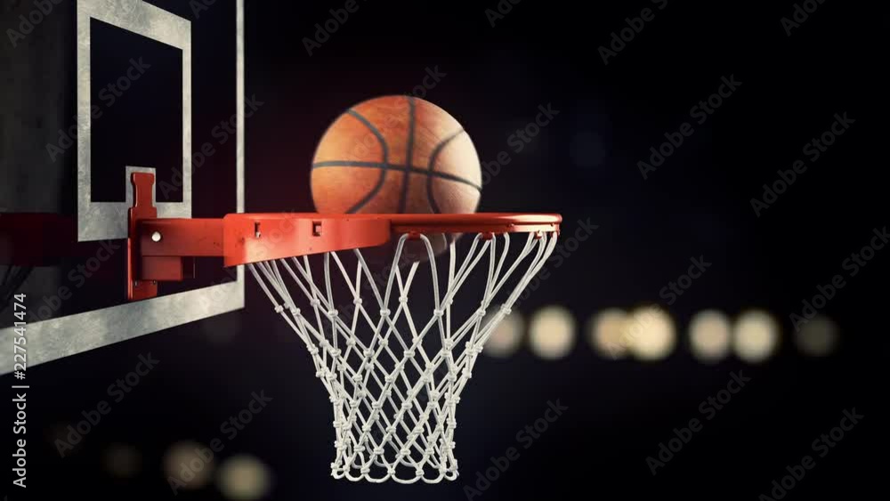 A throw in a basketball ring on a beautiful background A throw in a basketball ring on a beautiful background