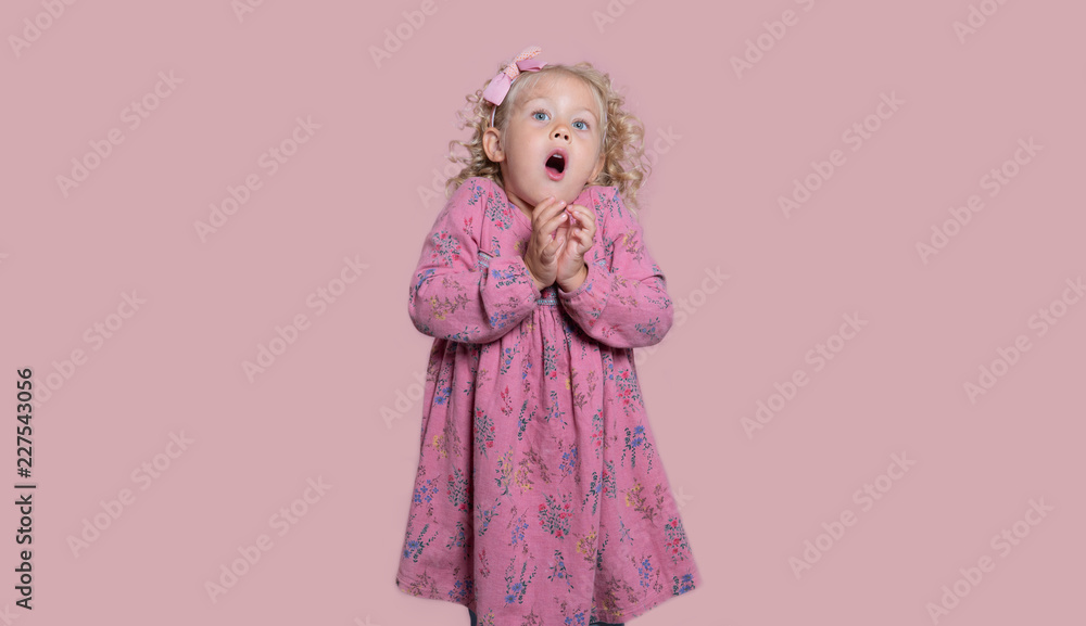 A small girl scared of something, isolated over white A small girl scared of something, isolated over white