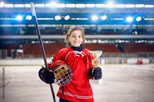 happy girl player ice hockey winner trophy.