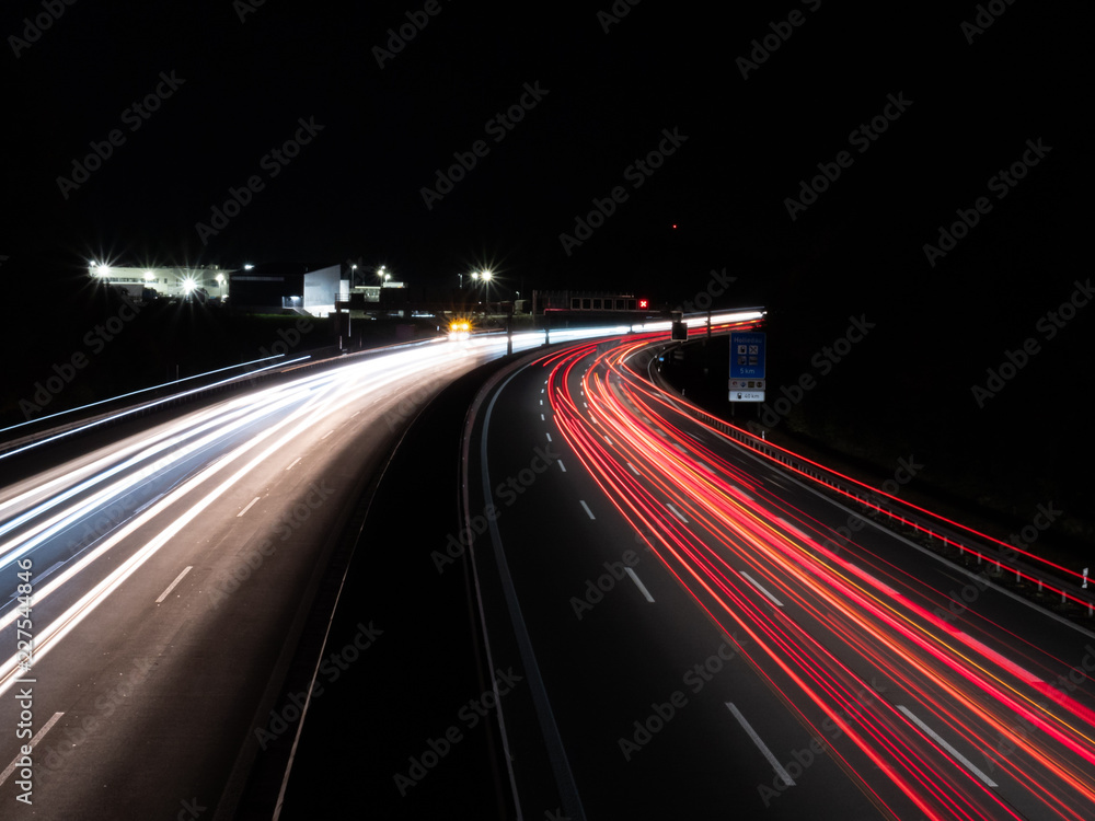 two colored highway at night with long exposure in bavaria germany