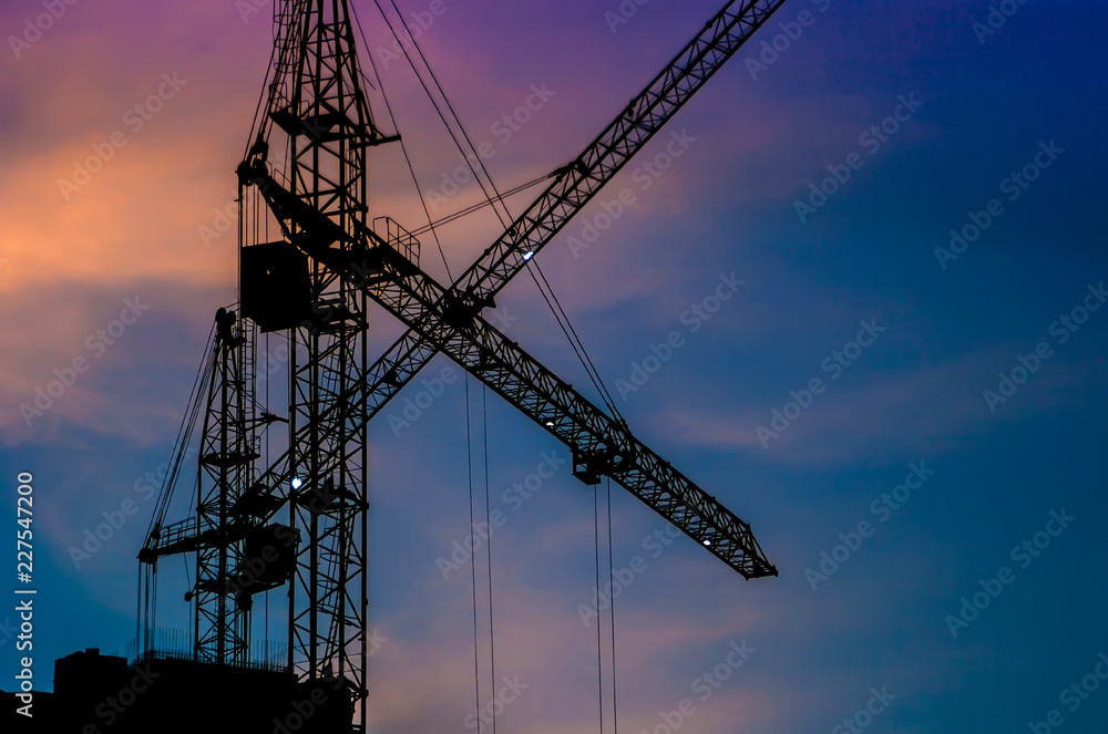 construction crane at sunset close-up