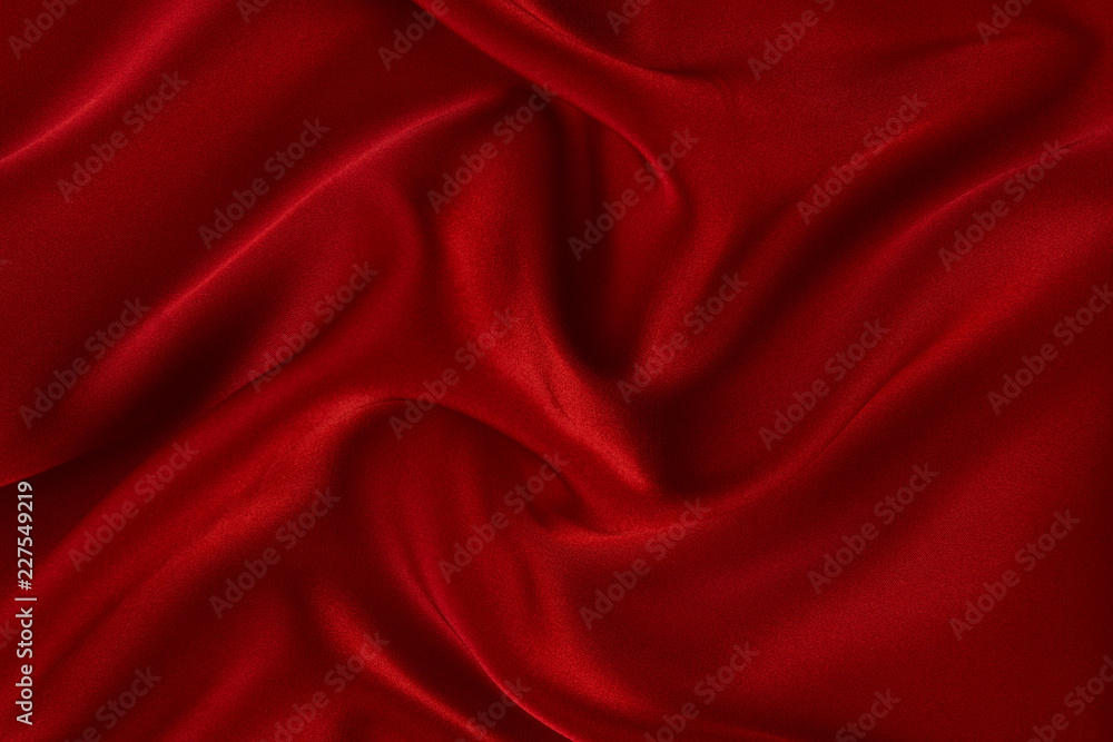 Red silk fabric background, view from above. Smooth elegant red silk or satin luxury cloth texture can use as abstract background with copy space. Red silk fabric background, view from above. Smooth elegant red silk or satin luxury cloth texture can use as abstract background with copy space.