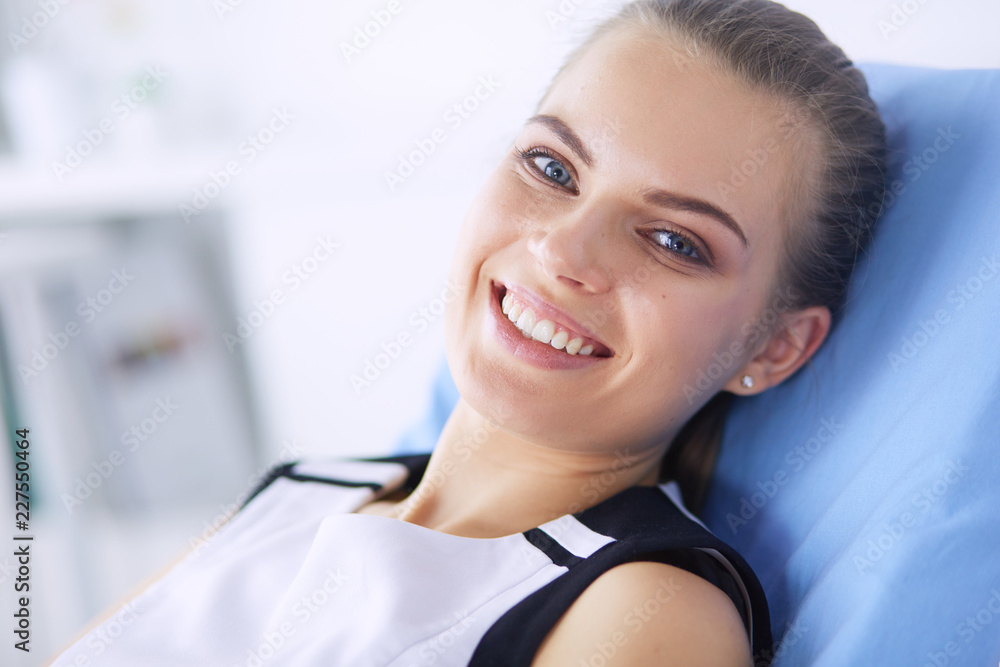 Close up portrait of healthy smiling woman lying at hospital.