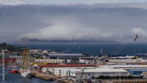 Nube sobre Isla San Martiño frente a puerto de Bouzas photo