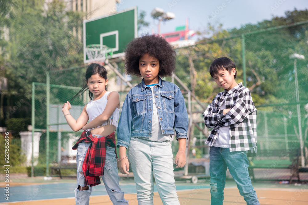 Portrait of three cool kids looking at camera Portrait of three cool kids looking at camera