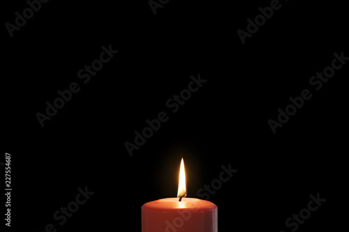 Christmas red candle in dark background
