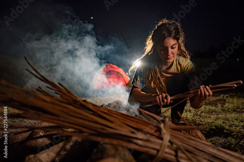 portrait a woman prepare make campfire