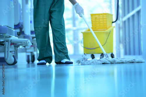 People clean flooring and clean with lint-free cloth towels or clean hospitals in Asia. photo