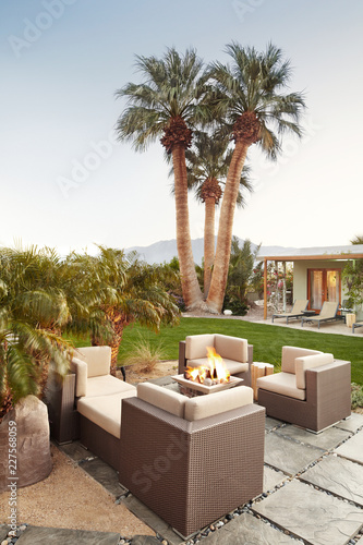 Outdoor lounge with fire pit at luxury hot springs in Palm Springs, California photo