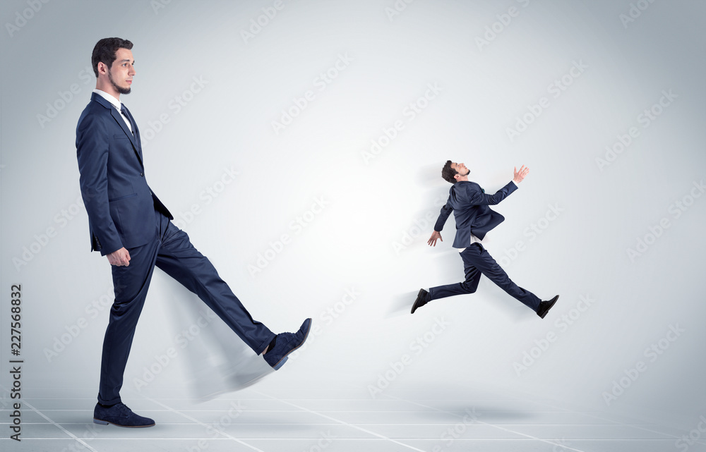 Young businessman fired cruel and aggressive by his boss with white background
Young businessman fired cruel and aggressive by his boss with white background