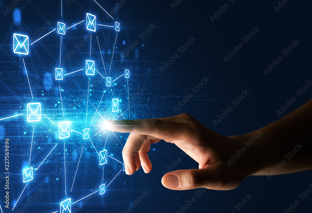 Fototapeta premium Kobiecy palec dotykający wiązki światła otoczonego niebieską grafiką z kopertami