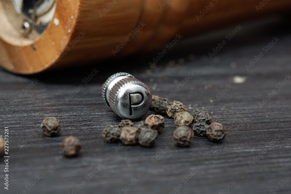 Black pepper with the grinder knob labelled as P Black pepper with the grinder knob labelled as P