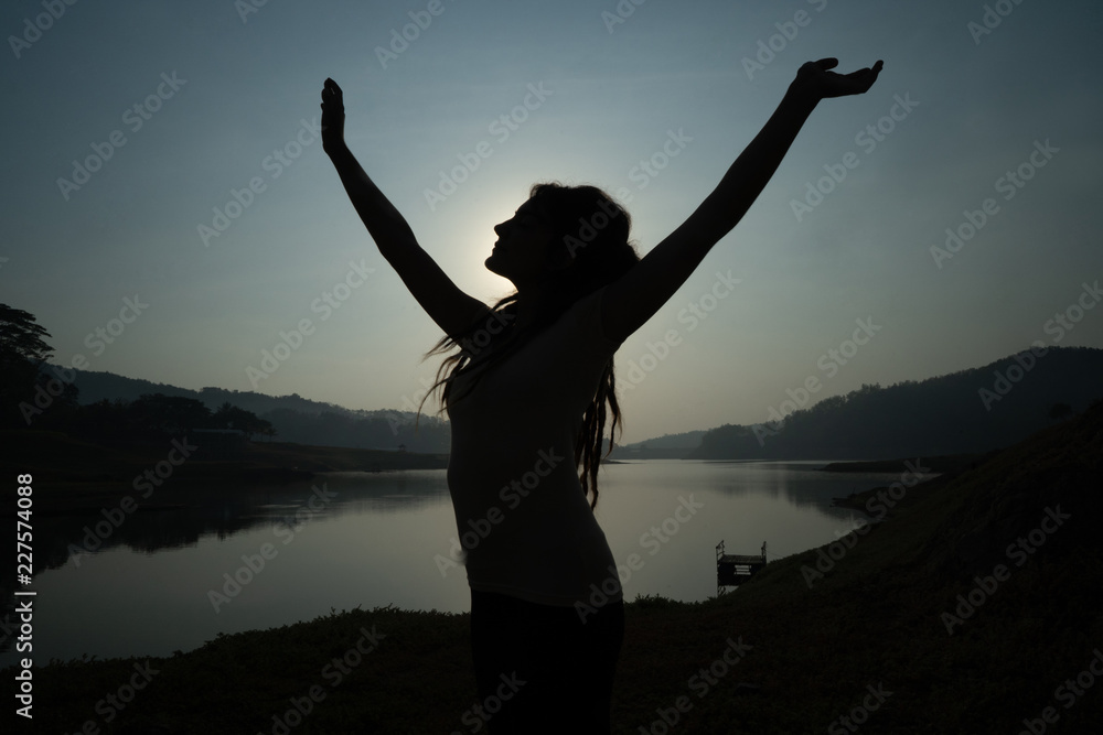Fototapeta premium portrait silhouette of woman wake up in the morning