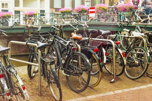 Different bicycles in the historical center of Amsterdam, Netherlands.