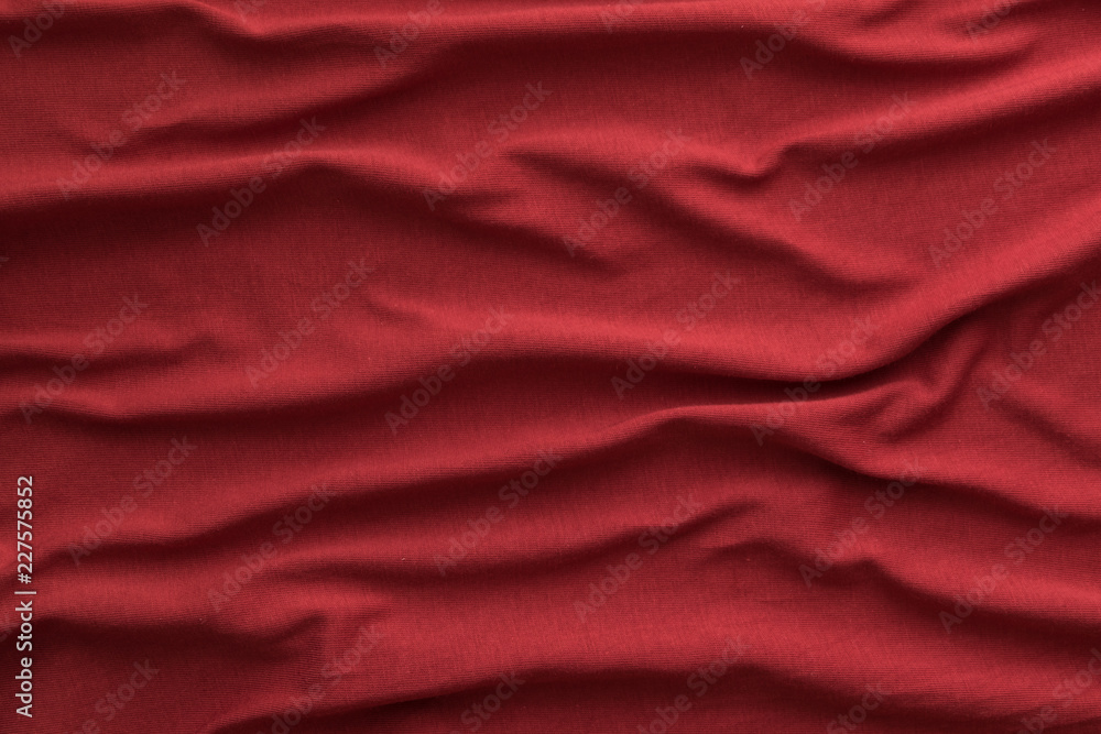 red cotton fabric wavy surface background red cotton fabric wavy surface background