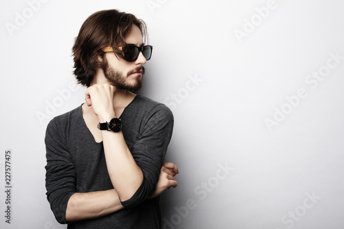 Fashion young man wearing fashionable sunglasses