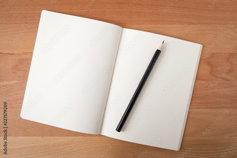 Top view open notebook white pages with pencil on wood texture desk background Top view open notebook white pages with pencil on wood texture desk background