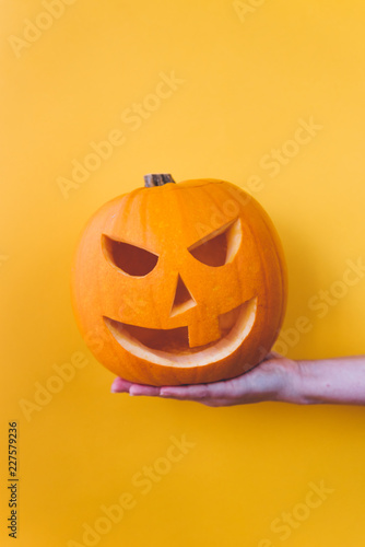 Holding pumpkin on a hand photo