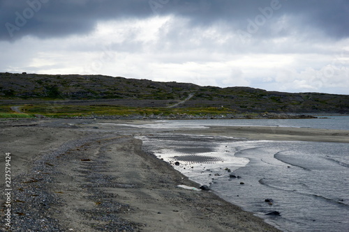 Low skies over Varanger Fjord bay of the Barents sea in summer.