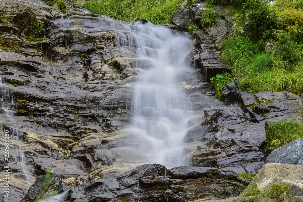 Waterfall in the forest in Austria near Heiligenblut am Großglockner Waterfall in the forest in Austria near Heiligenblut am Großglockner