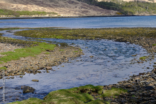 The river winds into the bay at Kinloch on the Isle of Rum