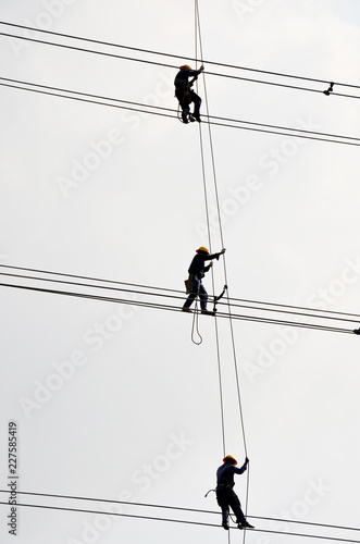 Electrician worker of Metropolitan Electricity Authority working repair electrical system on electricity pillar or Utility pole