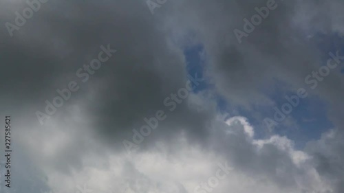 Dramatic atmosphere panorama 4K Time-lapse footage  clip of blue sky and storm clouds on tropical season.