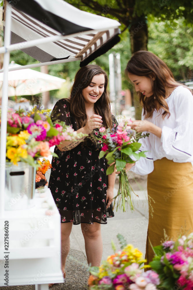 Flower cart owner helping customer