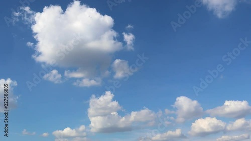 Dramatic atmosphere panorama view 4K Time-lapse footage video clip of blue sky and clouds on beautiful summer day.