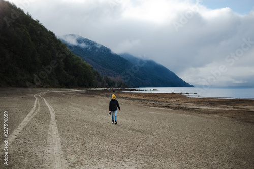 Portrait of a woman exploring a lake in Patagonia photo