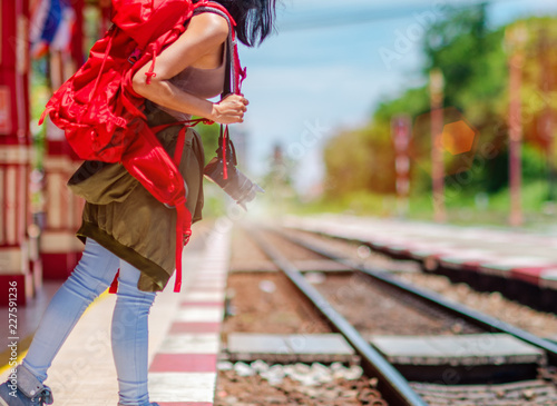woman traveler looking for next train arrive to the station , waiting worry in hurry up to reach destination