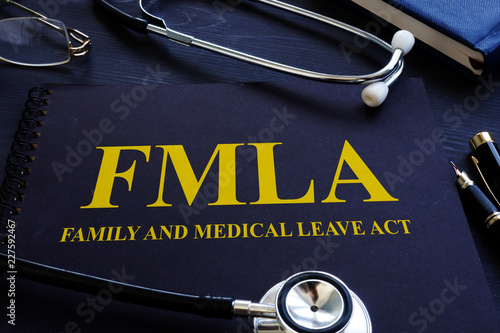 FMLA family and medical leave act and stethoscope. photo