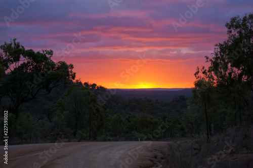 Incredibly beautiful and colorful sunset over forest, Australia. Natural background. photo