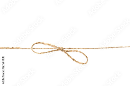 Hemp rope with bow knot on white background © New Africa