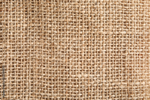 Sustainable hemp fabric as background, top view