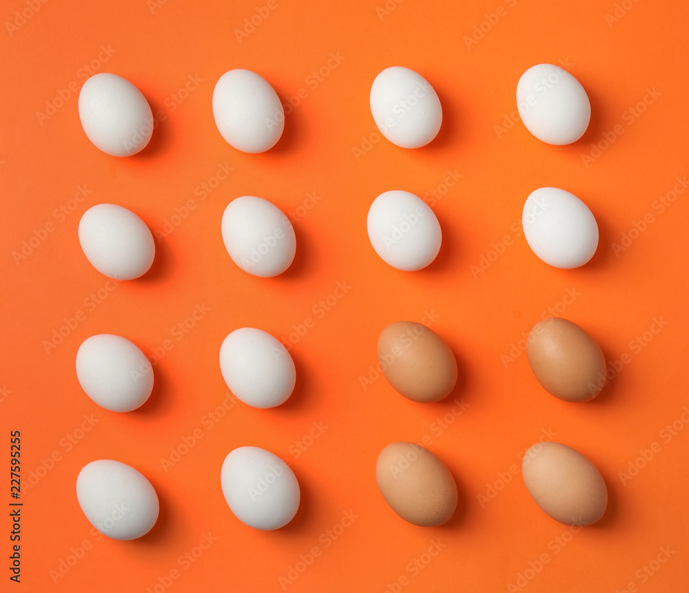 Raw chicken eggs on color background, top view