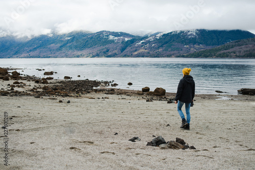 Portrait of a woman exploring a lake in Patagonia photo