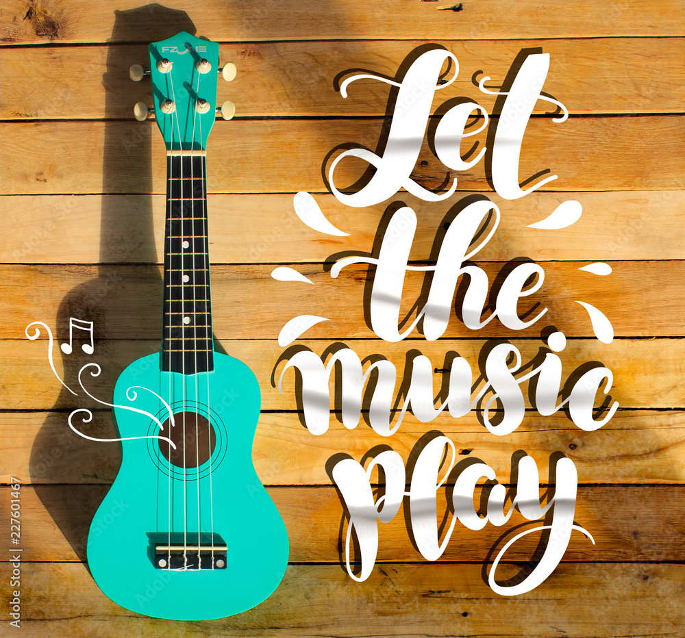 Guitar photo and handwritten digital text "Let the music play". Music  stamp, logo, poster. Stock Photo | Adobe Stock